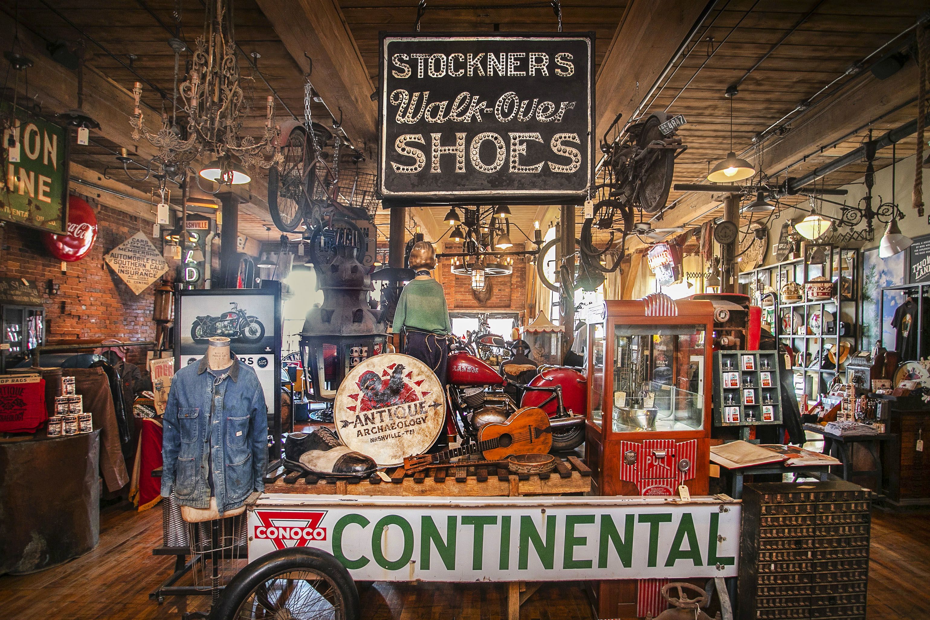 2 vintage cars in a driveway